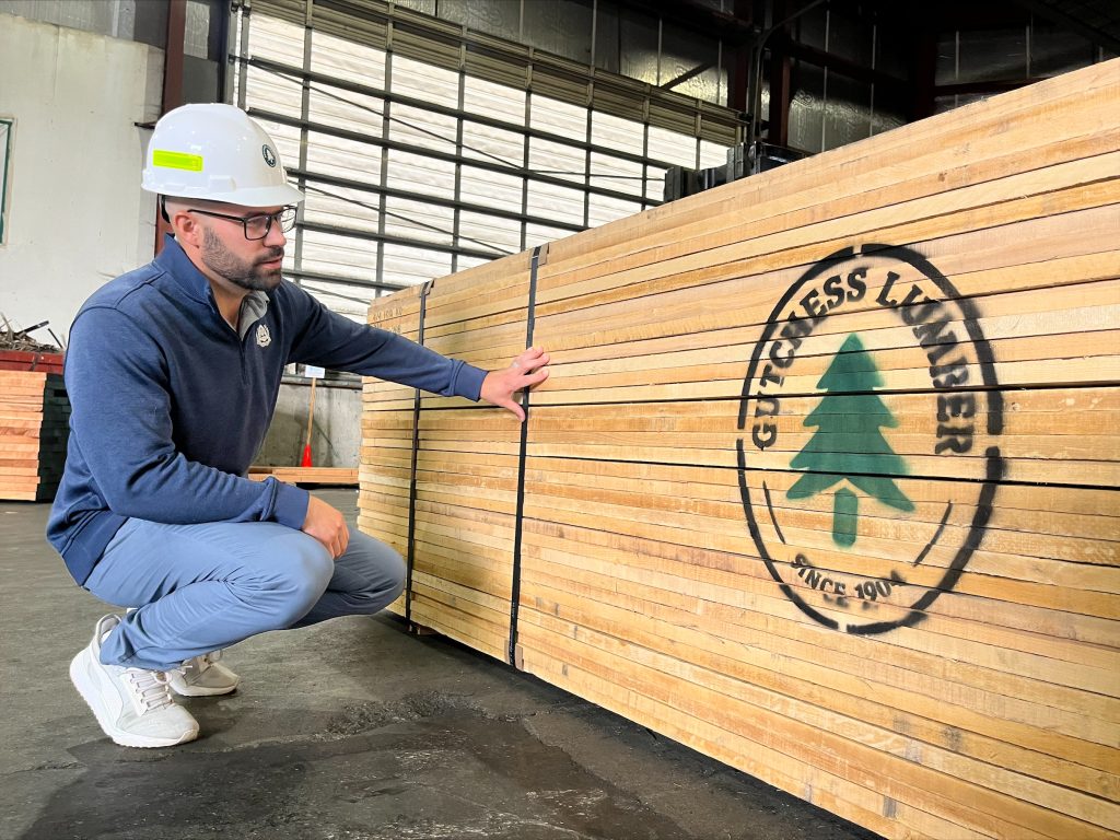 Gutchess Lumber sales team member Pat M. Semeraro inspecting hardwood pack